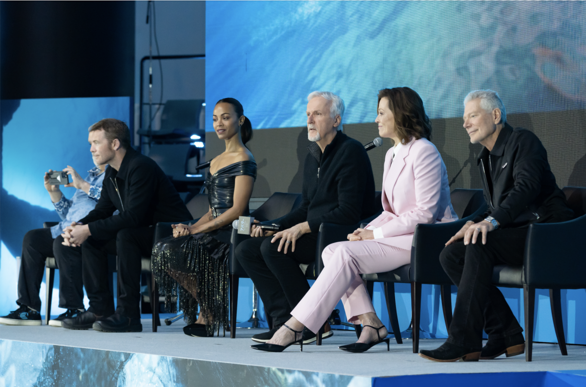 The cast of Avatar: The Way of Water and director James Cameron (center) at a Tokyo press conference in 2022